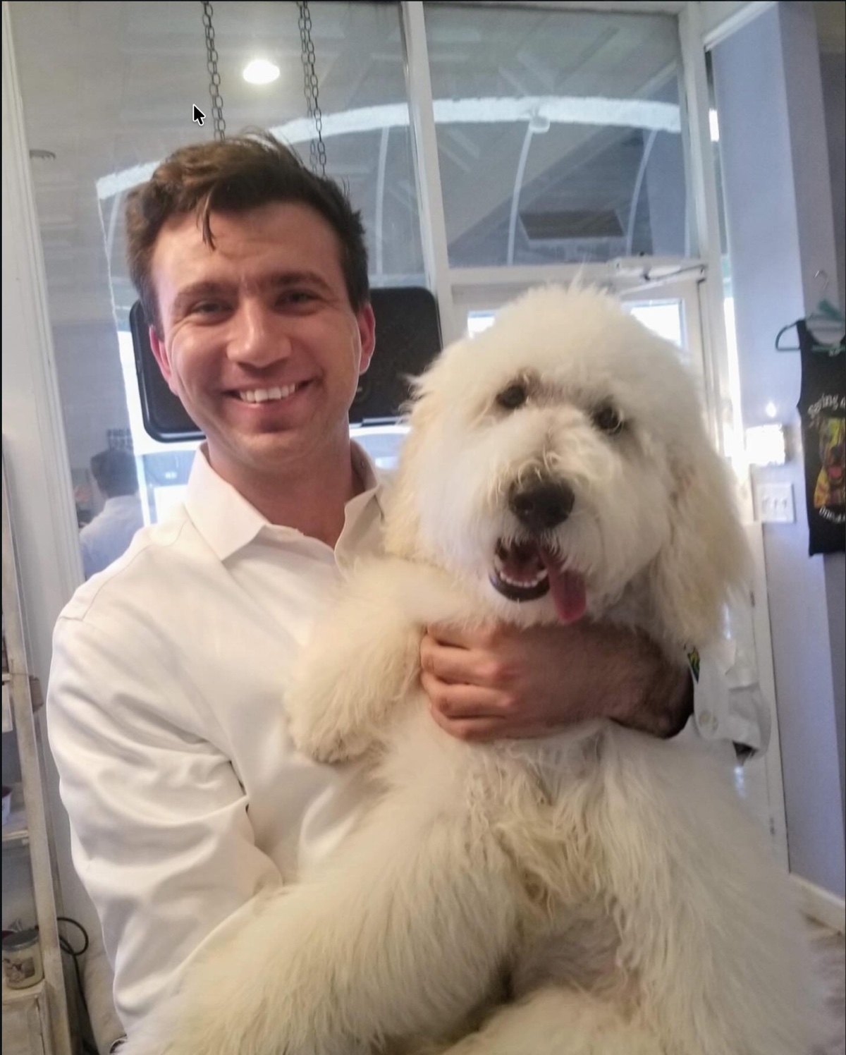 Dan holding Fluff at the groomer